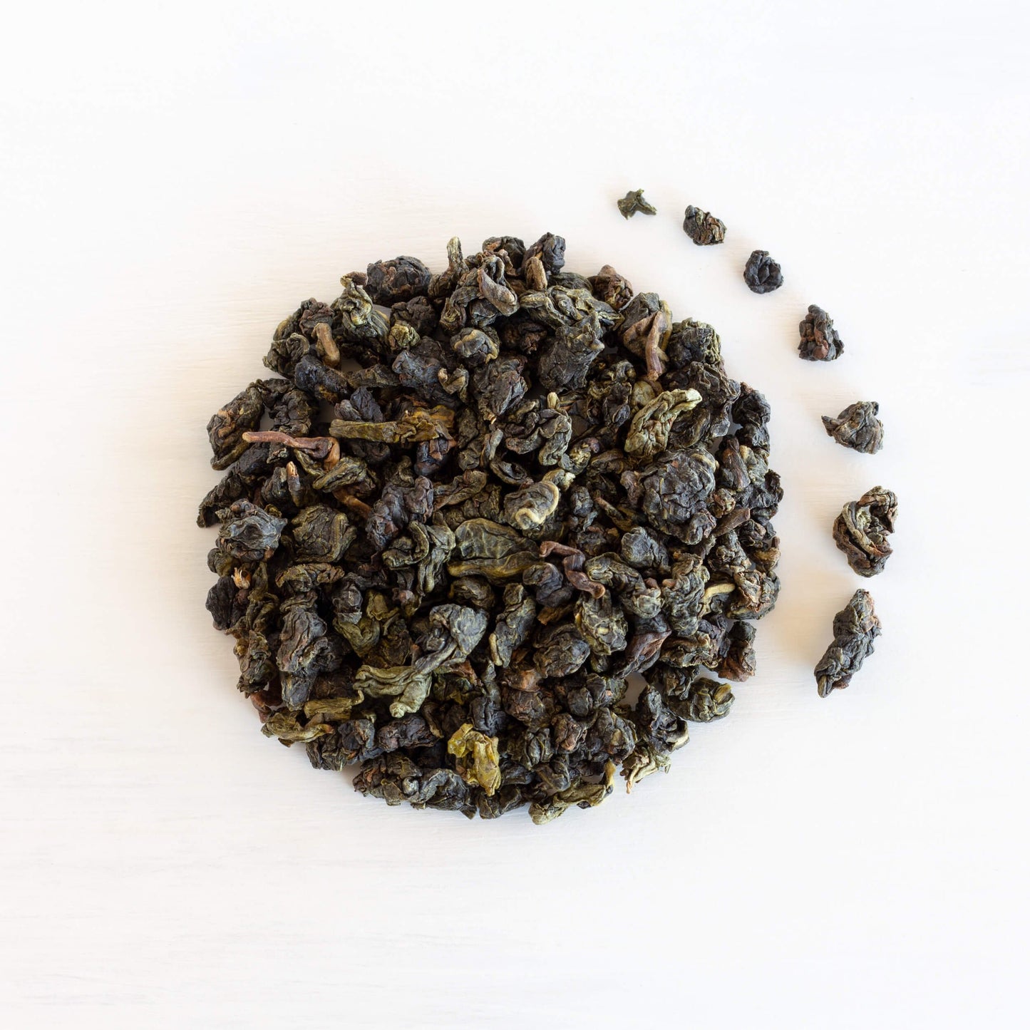 Jade Song Oolong Tea shown from above as loose leaf tea in a circle.