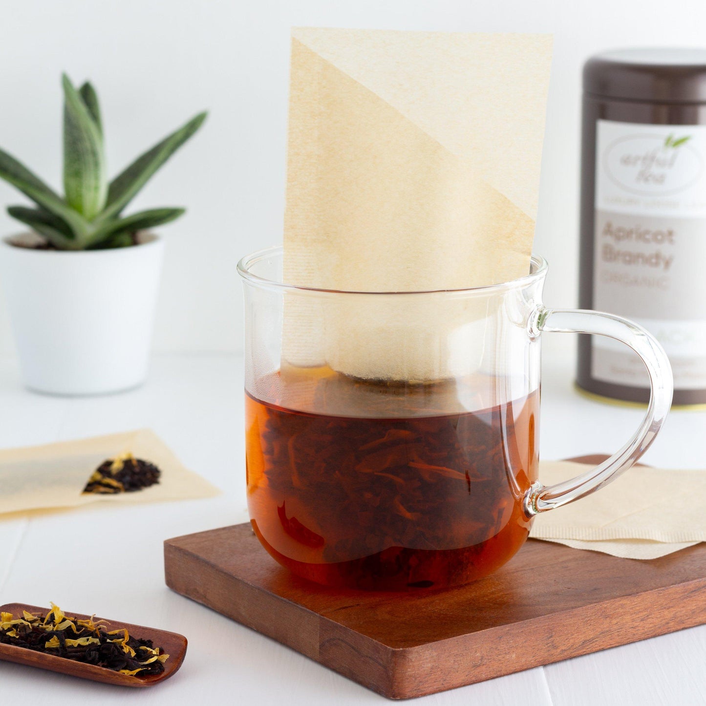 Tea Filter standing in glass mug with tea steeping