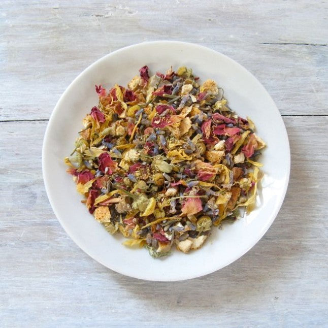 Lavender Lullaby Herbal Tea show from above as loose leaf tea in a white bowl.