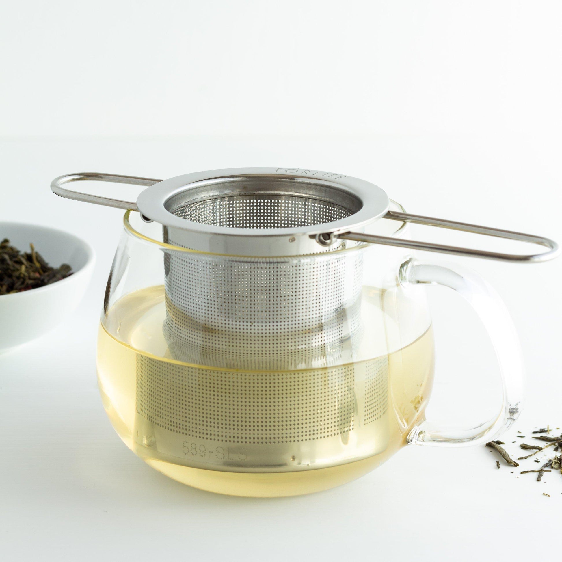 Tea Infuser Basket with Folding Handles (shown in a glass with steeped tea)