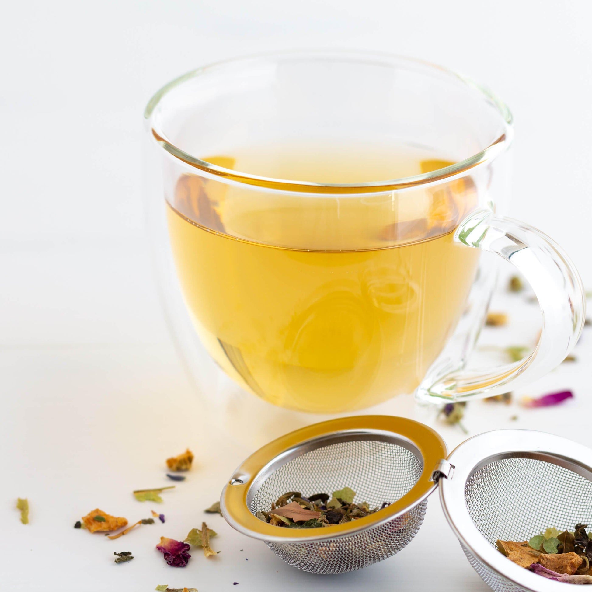 Glass mug of Tuscan Sun Herbal Tea with infuser