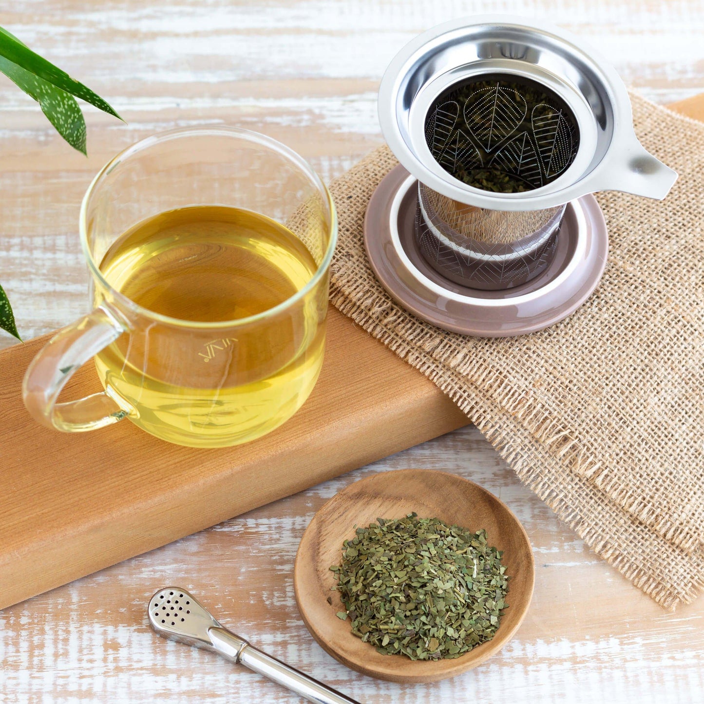 Glass mug of Yerba Mate Organic Tea with infuser and brown lid