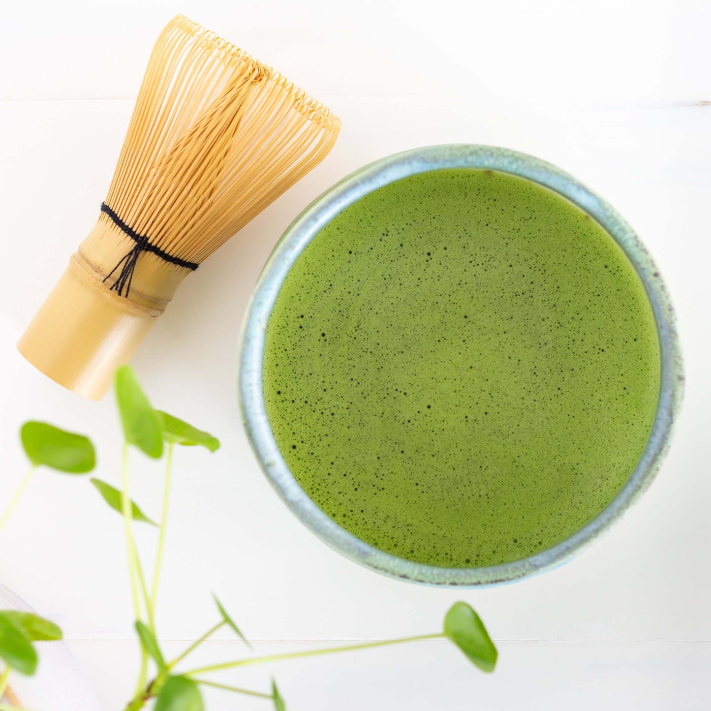 Bowl of matcha with whisk