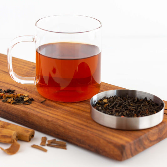 Glass mug of Cinnamon Pu-erh Tea with stainless steel lid