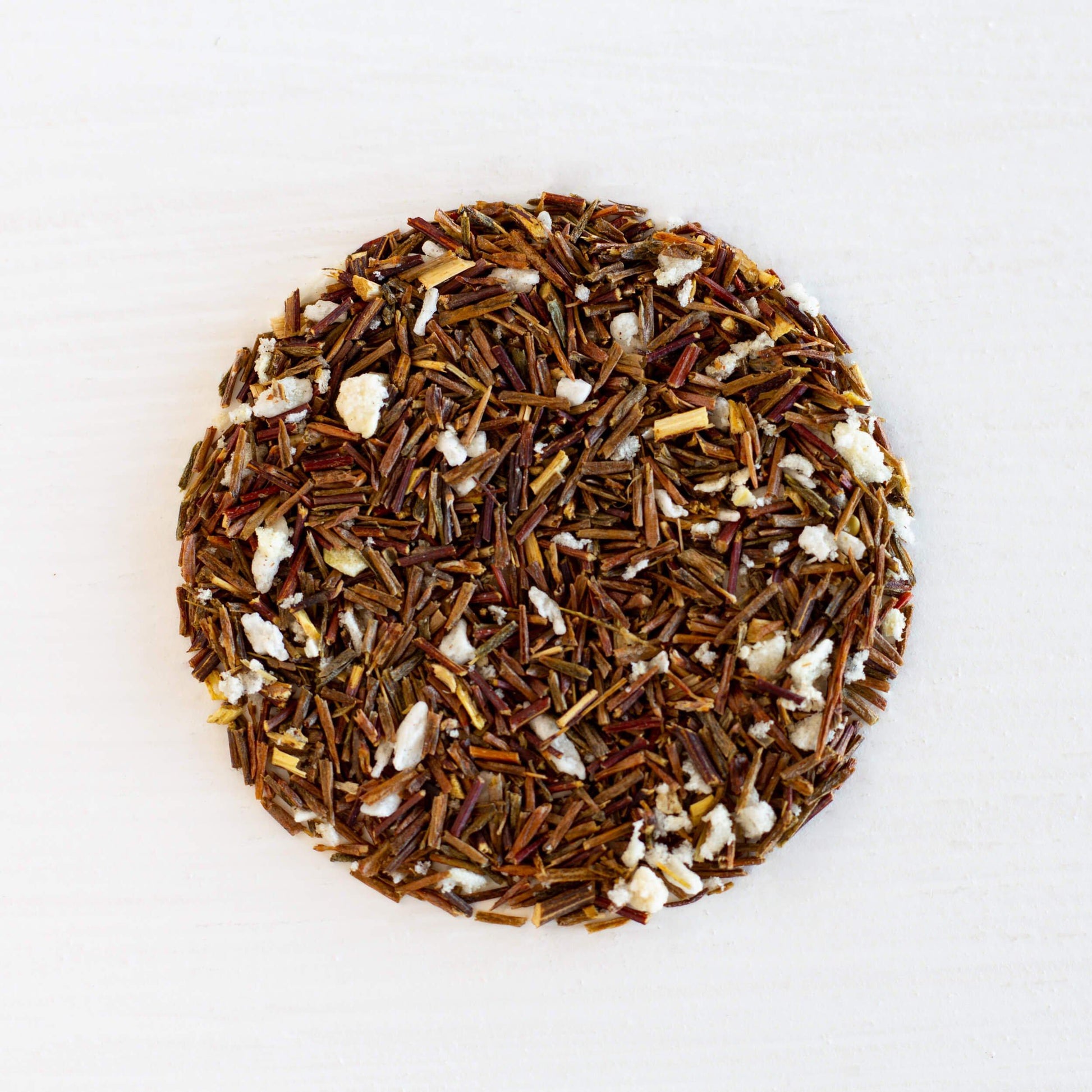 Carmen Miranda Rooibos Organic Herbal Tea shown from above as loose leaf tea in a tight circle