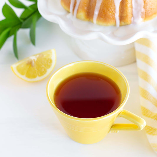Yellow cup of Lemon Cream Rooibos Organic Herbal Tea with lemon slice