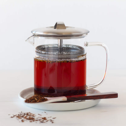 Small glass French Press of Vanilla Rooibos Herbal Tea with spoon