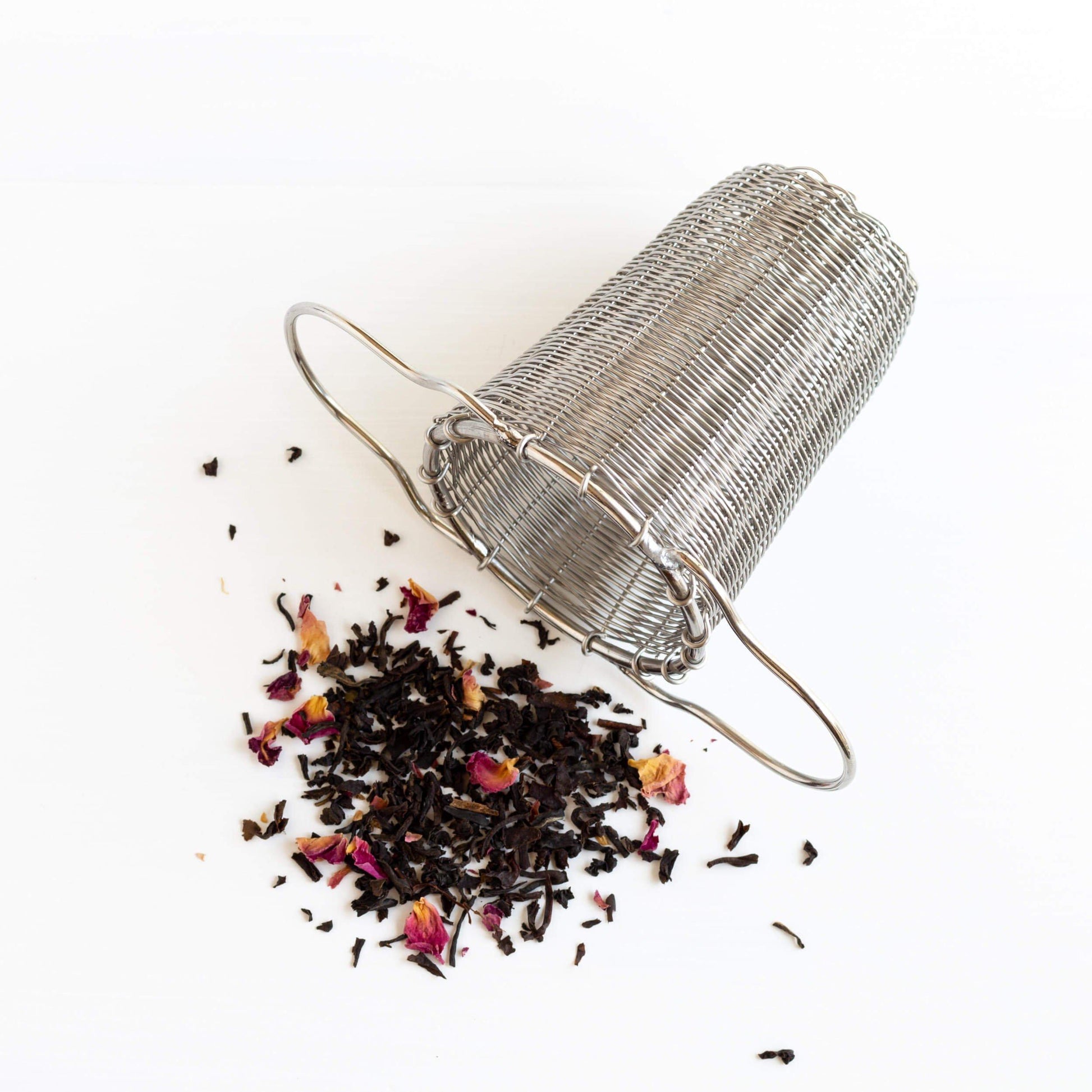 Tea strainer with tea leaves spilling out